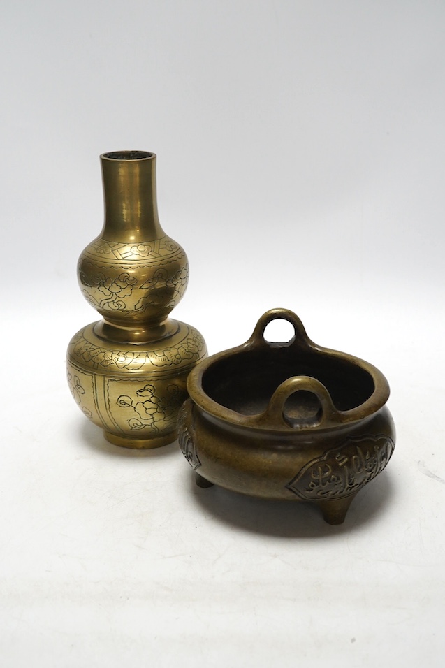 A Chinese bronze tripod censer and a similar double gourd vase, 21cm. Condition - poor to fair, vase has obvious repair to body